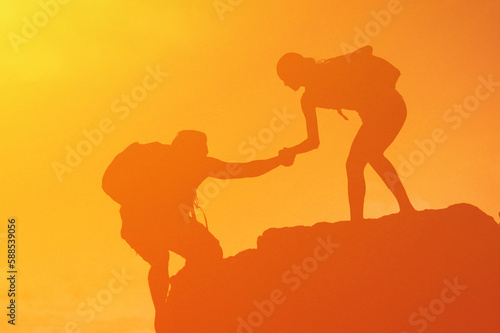 Hiker giving help assistance to a friend 
