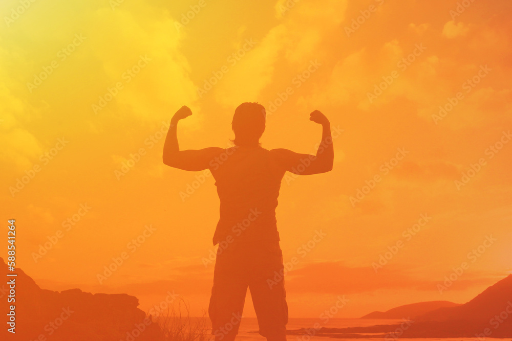 Hiker with arms up standing on the top of the mountain - Successful man enjoying triumph - Sport and success concept Hiker with arms up standing on the top of the mountain - Successful man enjoying triumph - Sport and success concept