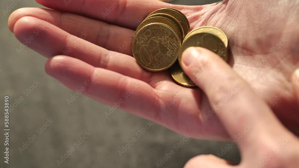Hand collects euro cents.Lack of money.Euro coins in hand . Insufficient small salary.Salaries, pensions and benefits in the European Union. Euro currency.Money and finance.4k footage Hand collects euro cents.Lack of money.Euro coins in hand . Insufficient small salary.Salaries, pensions and benefits in the European Union. Euro currency.Money and finance.4k footage
