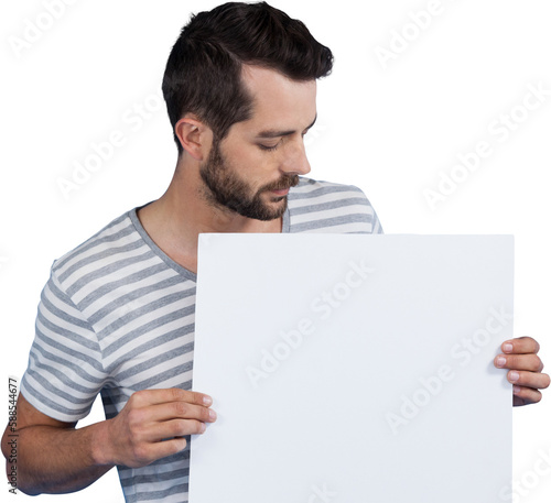 Young man looking at blank cardboard