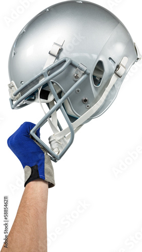 Cropped image of American football player handing his helmet