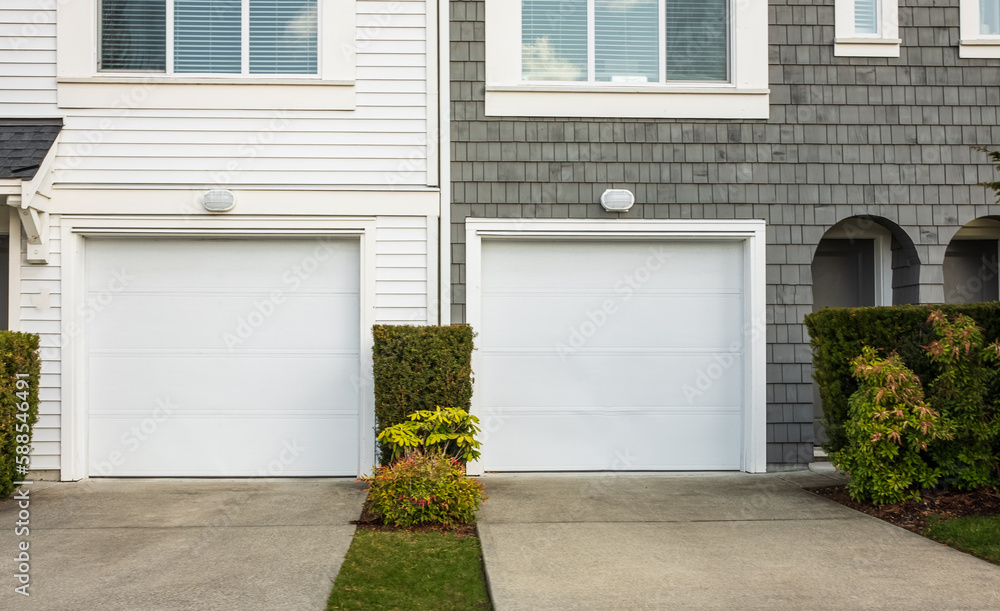 Double garage with short driveway. Wide Garage Door with concrete