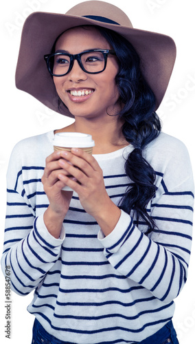 Attractive Asian woman with hat holding disposable cup