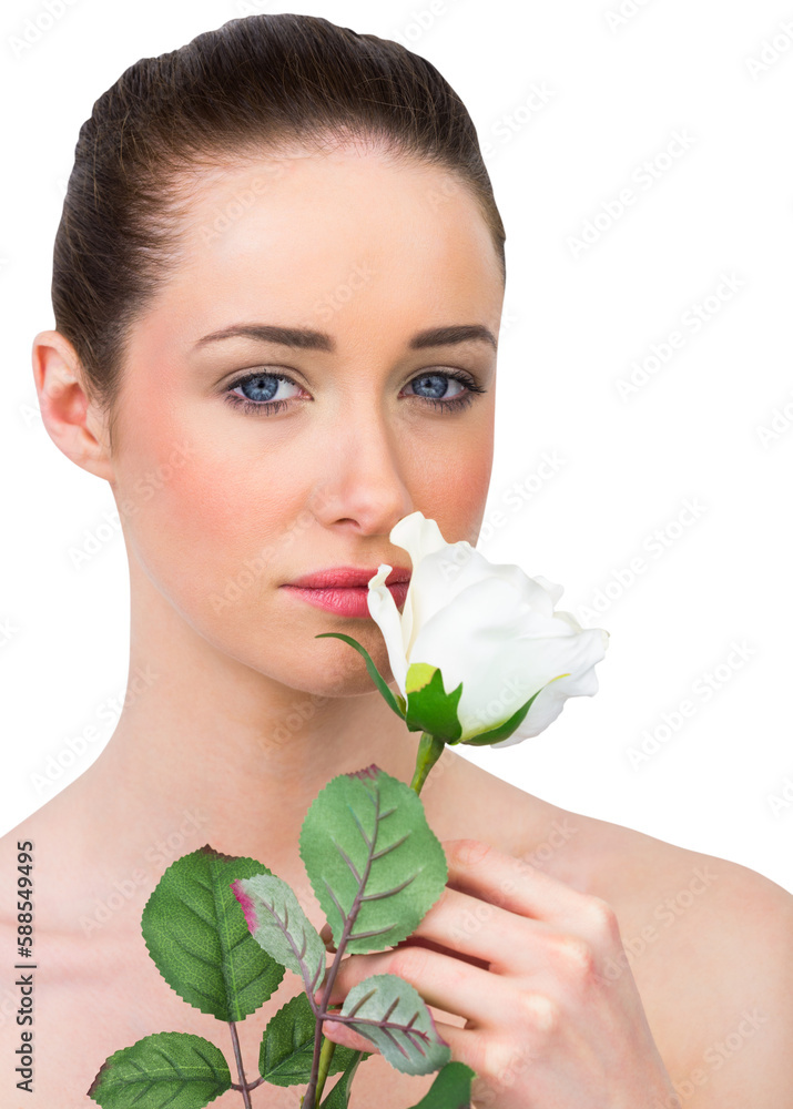Obraz premium Beautiful brunette smelling white rose