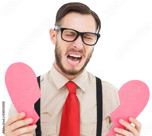 Geeky hipster crying and holding broken heart card