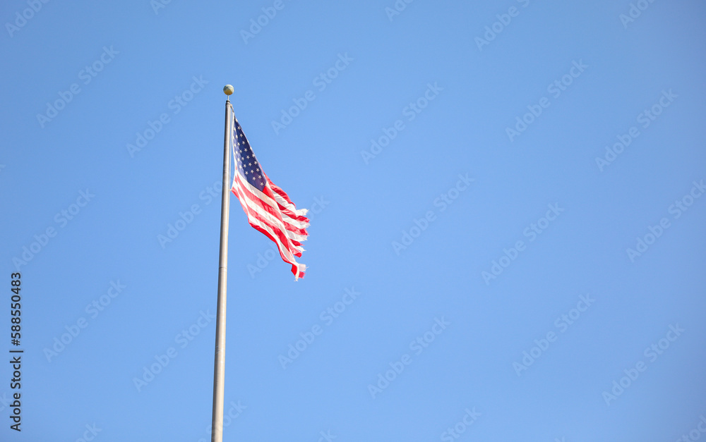 The US flag on a pole is a symbol of patriotism and unity, representing the country's values, history, and people. Its design and colors have symbolic meaning The US flag on a pole is a symbol of patriotism and unity, representing the country's values, history, and people. Its design and colors have symbolic meaning