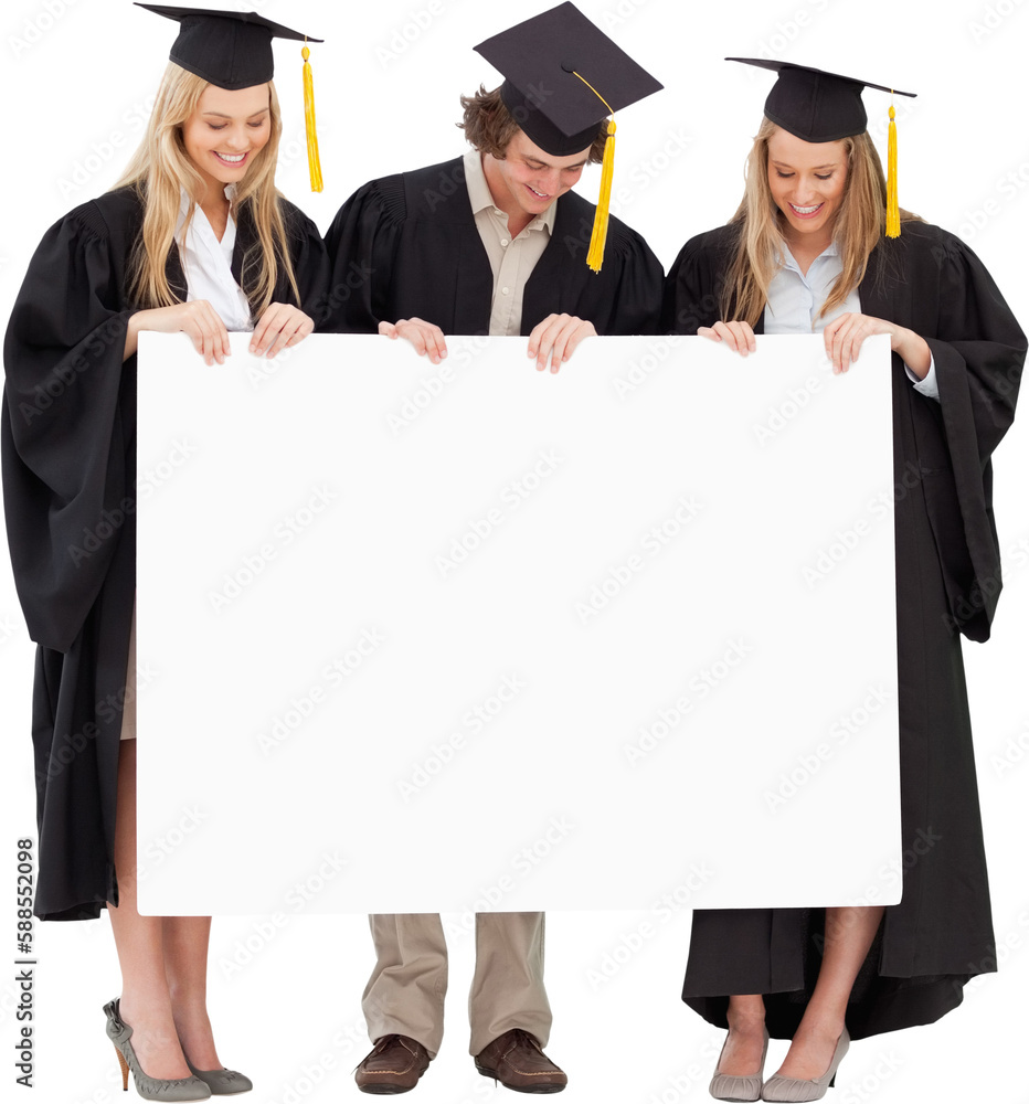 Three smiling students in graduate robe holding a blank sign Three smiling students in graduate robe holding a blank sign