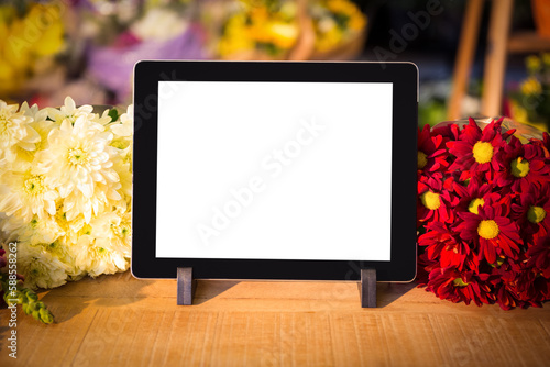 Digital tablet and fresh flowers