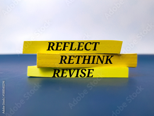 Fotografija Yellow book with the word REFLECT RETHINK REVISE.