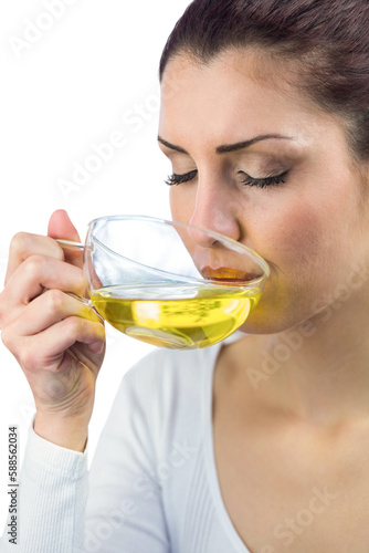 Peaceful woman drinking herbal tea