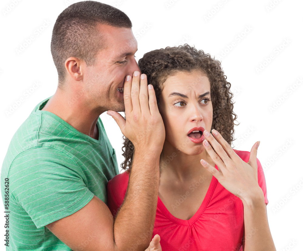 Businessman whispering secret into female colleague's ear Businessman whispering secret into female colleague's ear