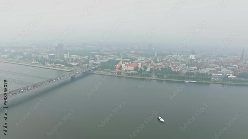 Aerial drone shot over beautiful panoramic view of St. Peter's Church and the Old Riga Town, Latvia on a cloudy day. Aerial drone shot over beautiful panoramic view of St. Peter's Church and the Old Riga Town, Latvia on a cloudy day.