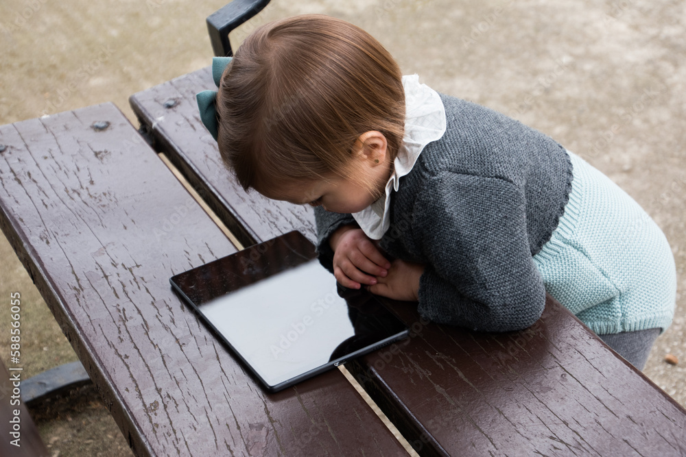 Kid Using The Oculus Rift 2 2 year old girl playing in the park with the tablet instead of non ...