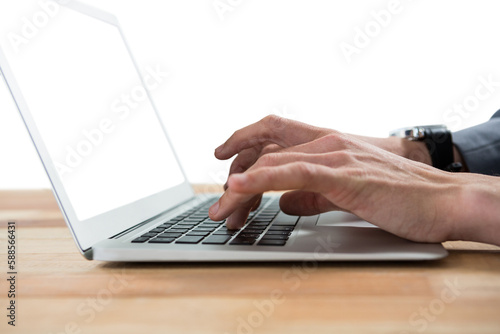 Cropped image of businessman typing on laptop