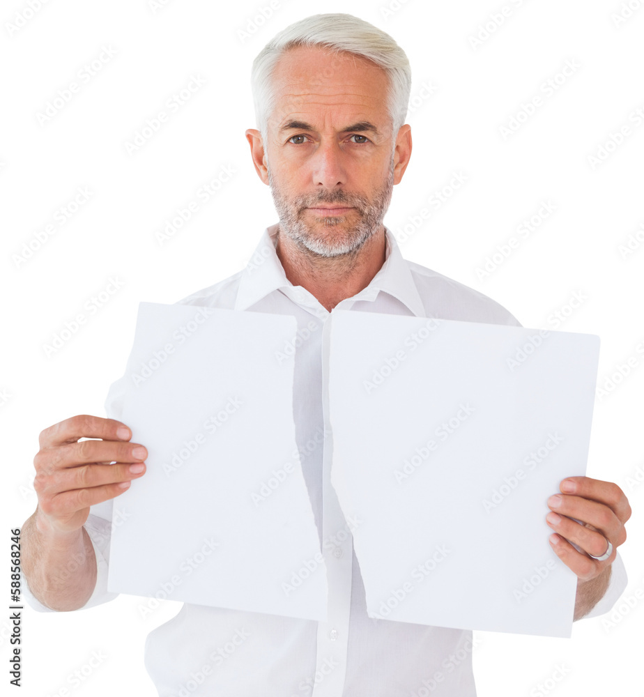 Serious man holding torn sheet of paper Serious man holding torn sheet of paper