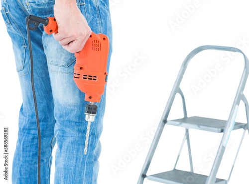 Worker holding drill in front of step ladder