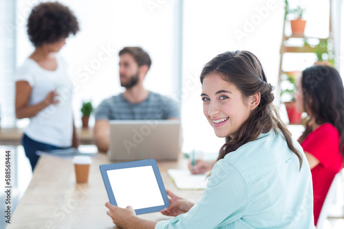 Smiling businesswoman using tablet 