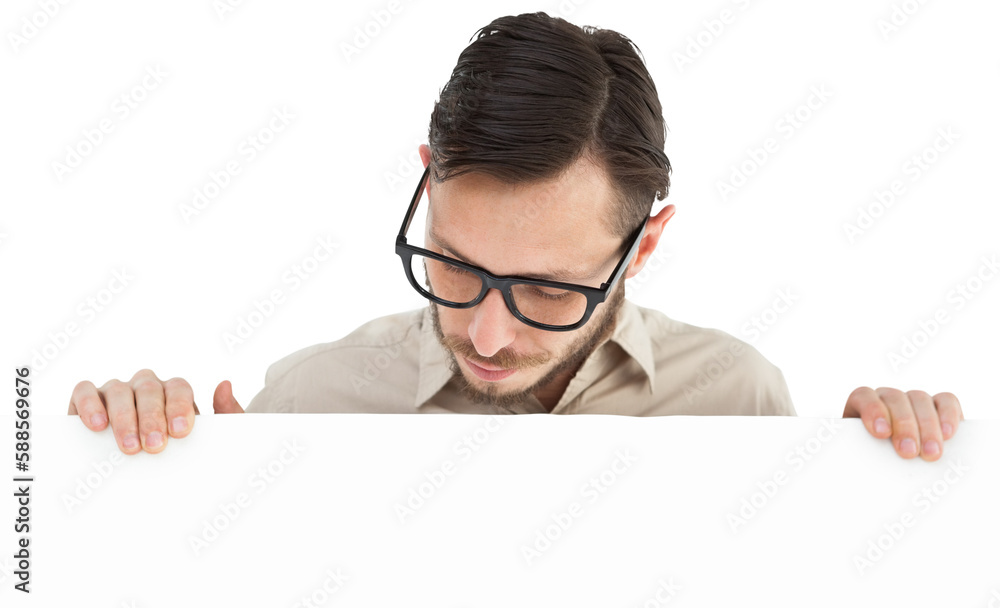 Geeky young hipster showing poster Geeky young hipster showing poster
