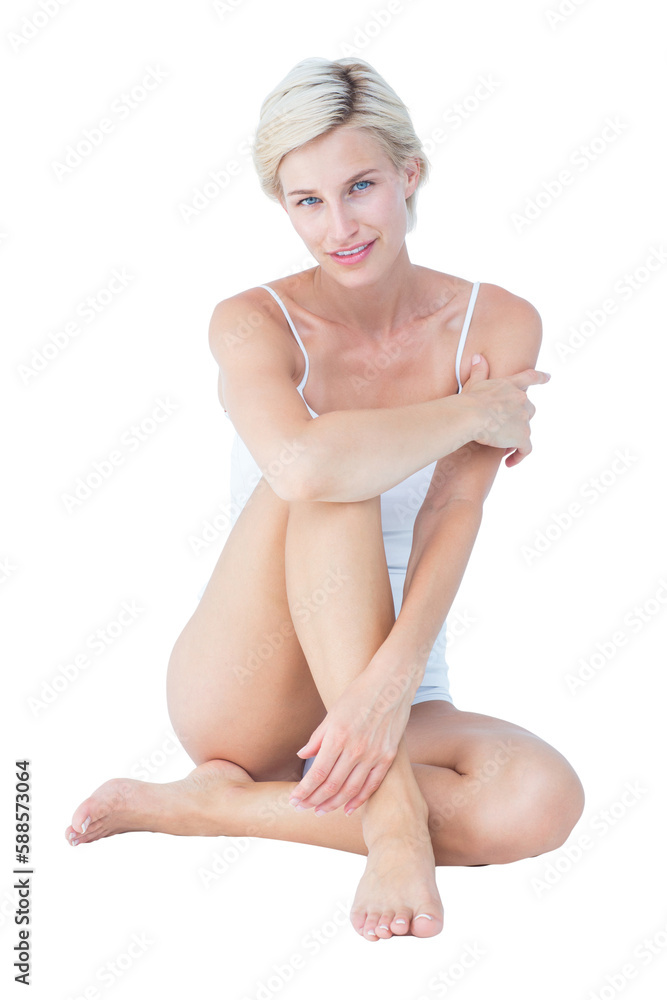 Obraz premium Gorgeous blonde sitting on the floor smiling at camera 