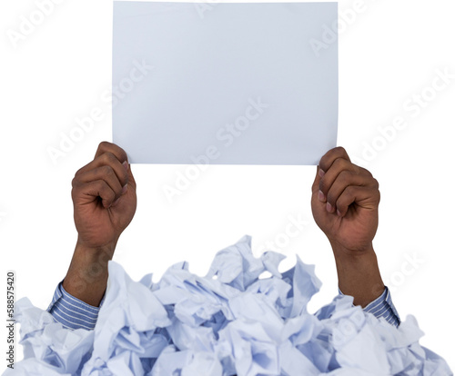 Heap of crumpled paper with hand holding blank page