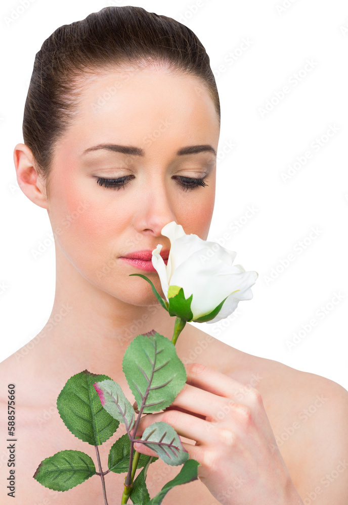 Fototapeta premium Beautiful brunette smelling white rose
