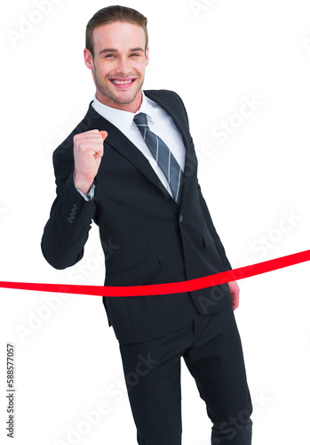 Happy businessman crossing the finish line