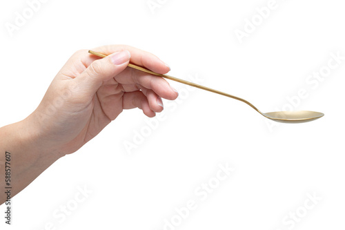 isolated of a woman's hand holding a steel spoon.