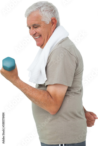 Side view of a senior man exercising with dumbbell