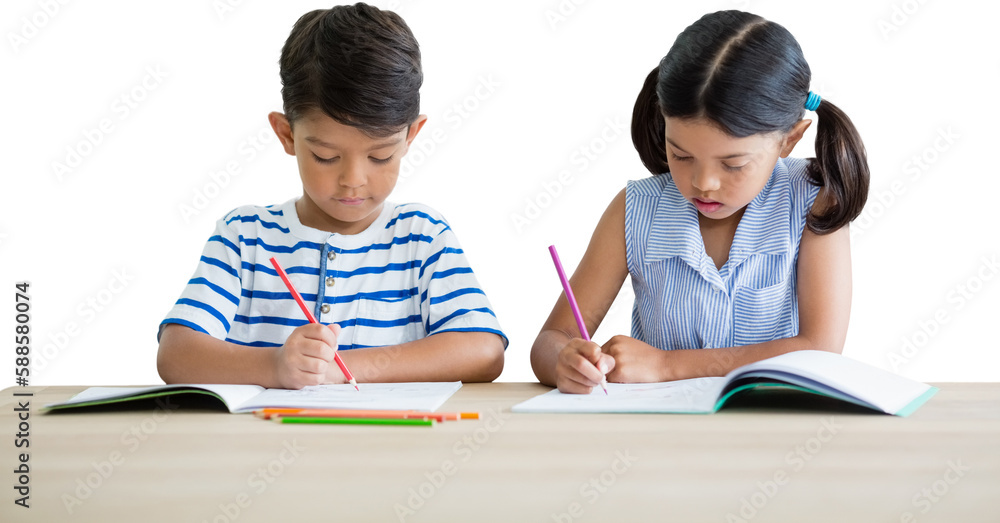 Children writing on books at table Children writing on books at table