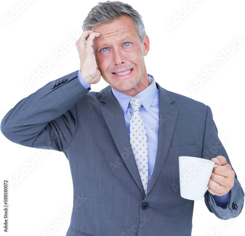 Irritated businessman holding coffee cup