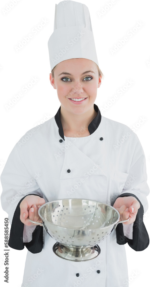 Portrait of smiling female chef holding colander