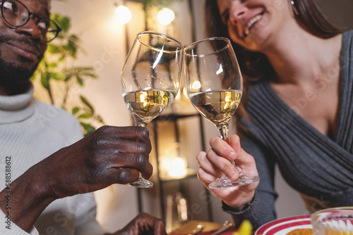 Interracial Couple Toasting with White Wine