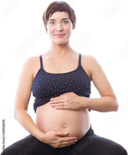 Portrait of happy pregnant woman holding belly