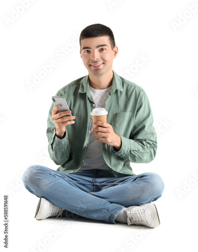 Young guy with cup of coffe...