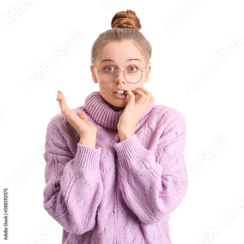 Young woman in sweater biti...