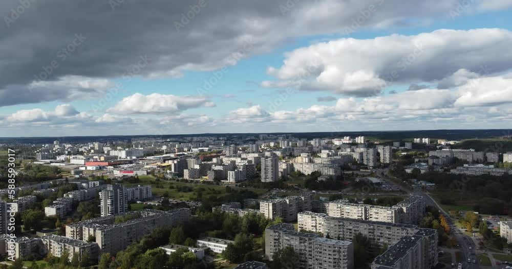 Aerial view of downtown Vilnius, Lithuania. You can see buildings in urban areas with large expanses of green areas adjacent to them, with lots of trees, with a bright sky, with lots of clouds. Aerial view of downtown Vilnius, Lithuania. You can see buildings in urban areas with large expanses of green areas adjacent to them, with lots of trees, with a bright sky, with lots of clouds.
