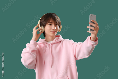 Teenage boy in headphones w...