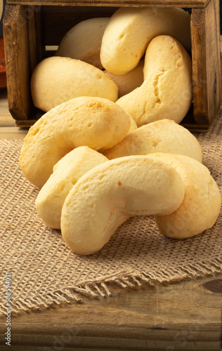 Brazilian cheese biscuit (biscoito de queijo) on jute. photo