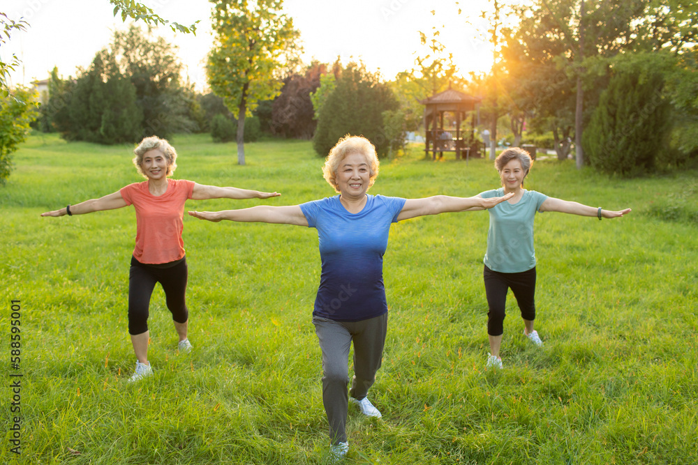 Happy senior Chinese friends exercising in park Happy senior Chinese friends exercising in park