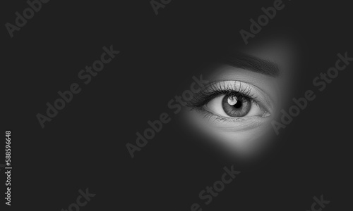 Woman eye looking through hole in darkness, Secret and Privacy 