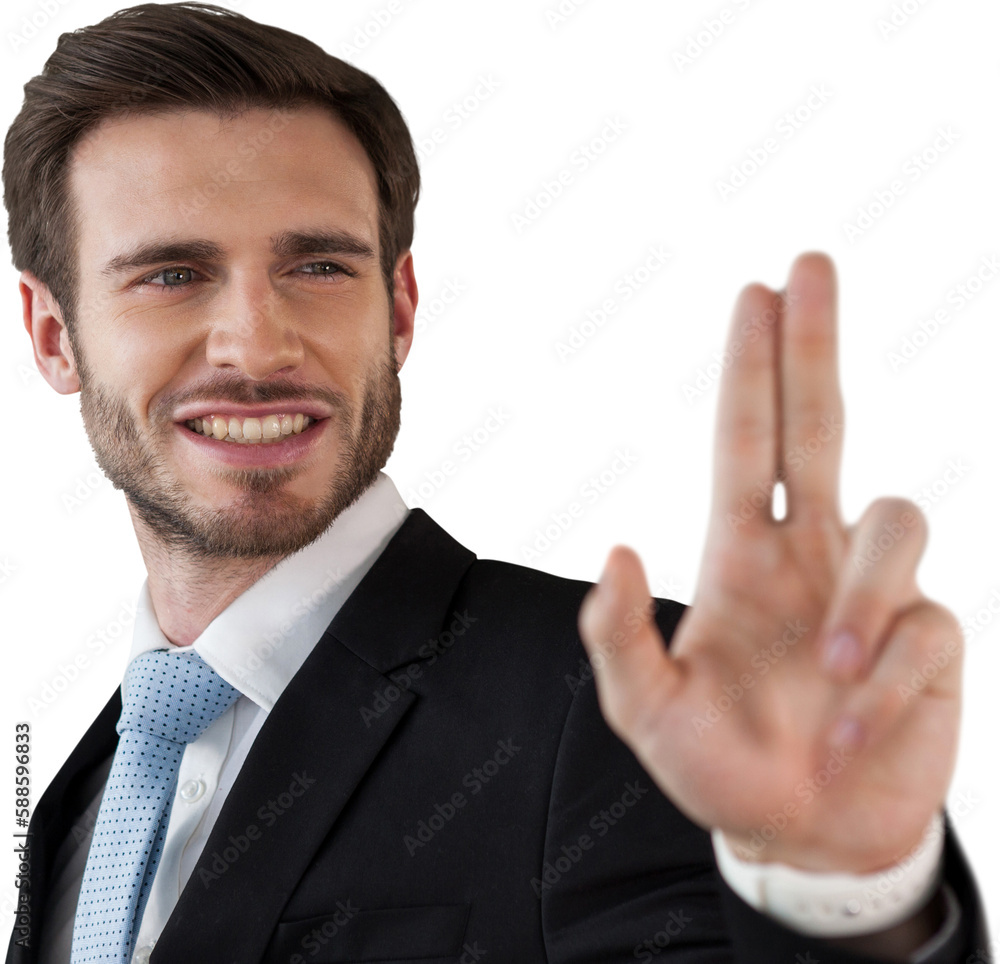 Smiling businessman touching invisible interface Smiling businessman touching invisible interface