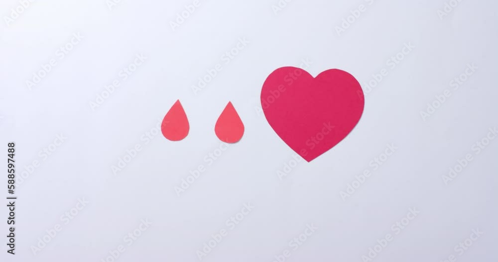 Hands of caucasian man over heart and blood drops on white background, slow motion Hands of caucasian man over heart and blood drops on white background, slow motion