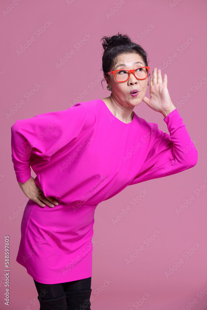 Studio shot of humorous senior Chinese woman Studio shot of humorous senior Chinese woman