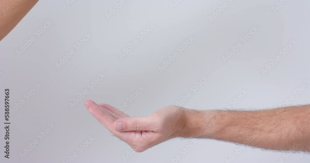 Hands of diverse people giving blood drop on white background, slow motion Hands of diverse people giving blood drop on white background, slow motion