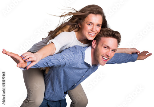 Smiling young man carrying woman