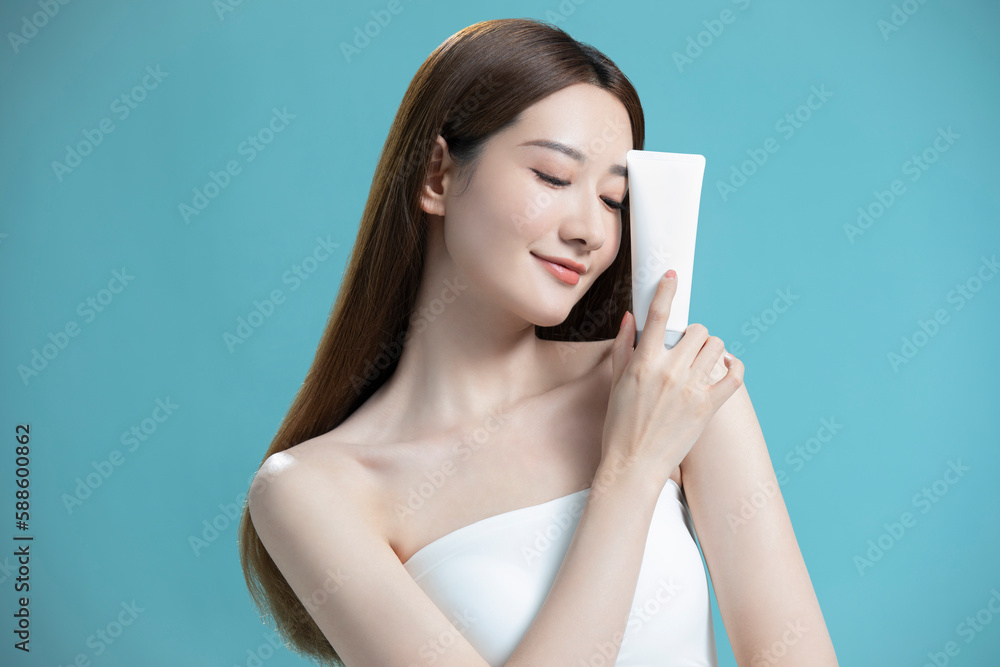 Beautiful young Chinese woman with face wash Beautiful young Chinese woman with face wash