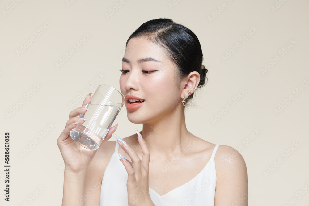 pretty young woman drinking water from glass pretty young woman drinking water from glass