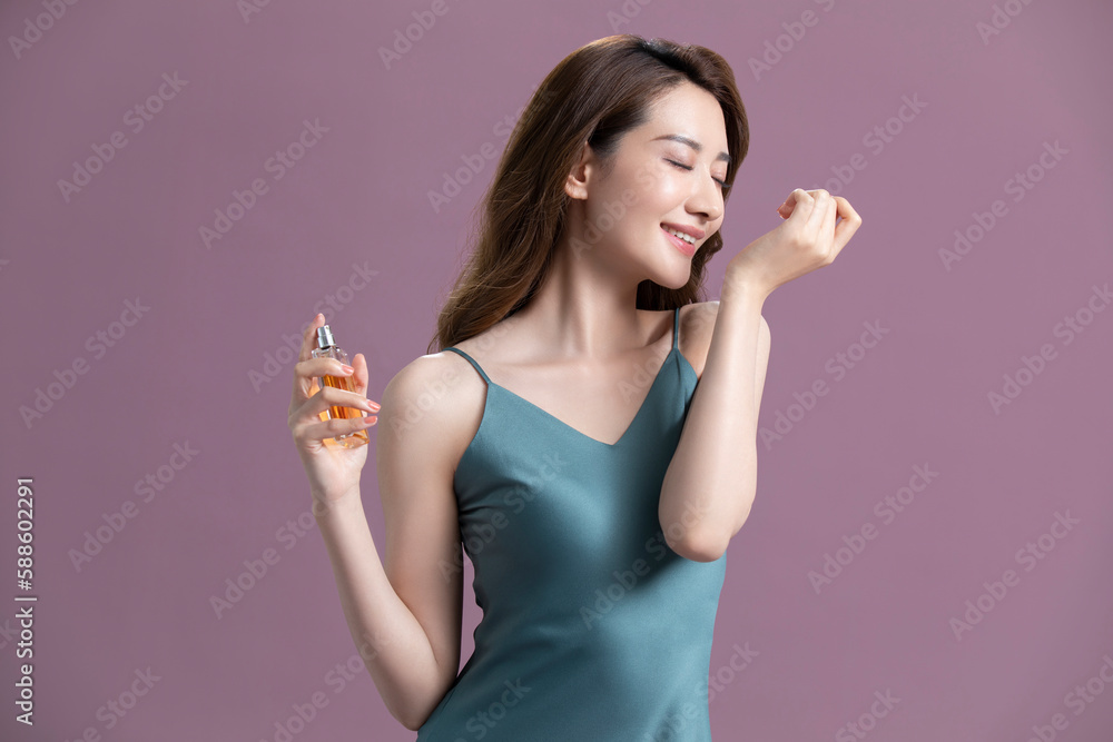 Beautiful young Chinese woman with perfume Beautiful young Chinese woman with perfume