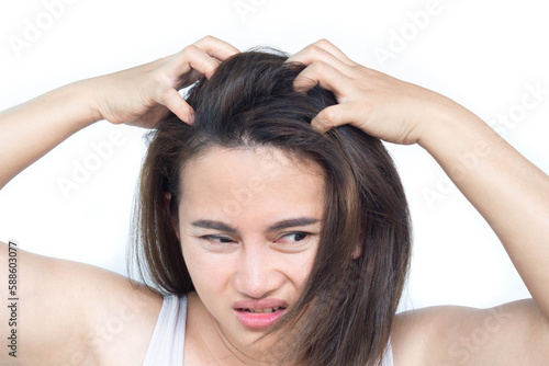 Closeup woman hand itchy scalp, for health care shampoo and beauty product concept Hair care concept