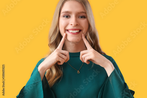 Young woman smiling on yell...